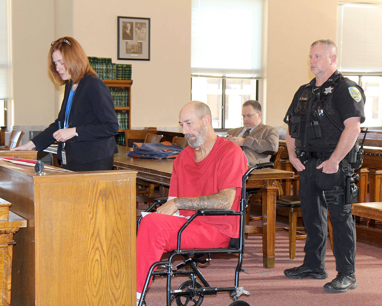 Michael Lang | Grays Harbor News Group                                Gary Peterson (second from left) appears Wednesday, Oct. 30, 2019, in Grays Harbor County Superior Court on charges of second degree assault and hit-and-run of an attended vehicle.