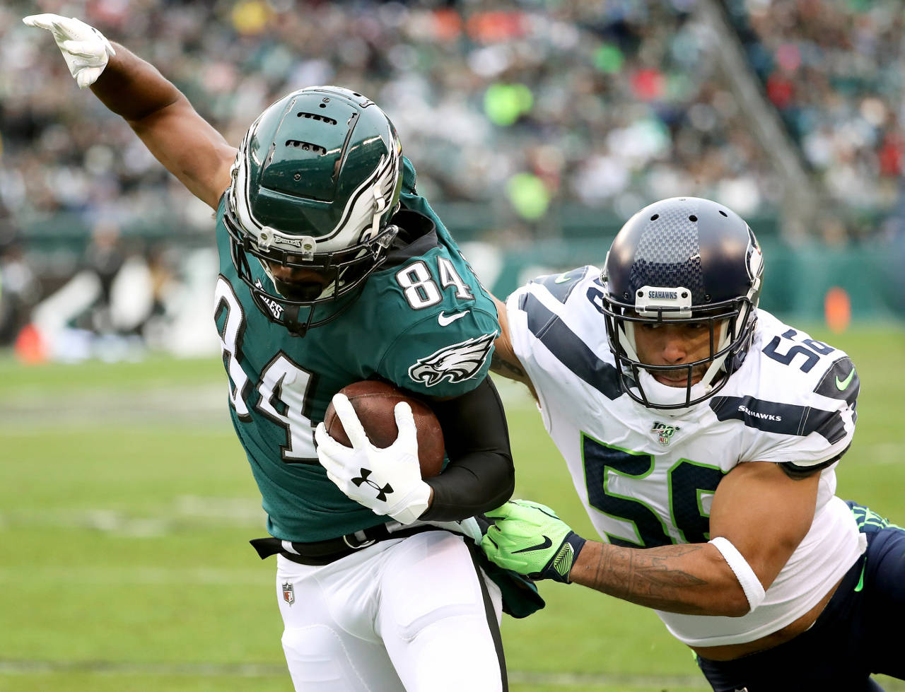 Philadelphia Eagles WR Greg Ward (84) is tackled by Seattle Seahawks LB Mychal Kendricks during Sunday’s game in Philadelphia. (Tribune News Service)