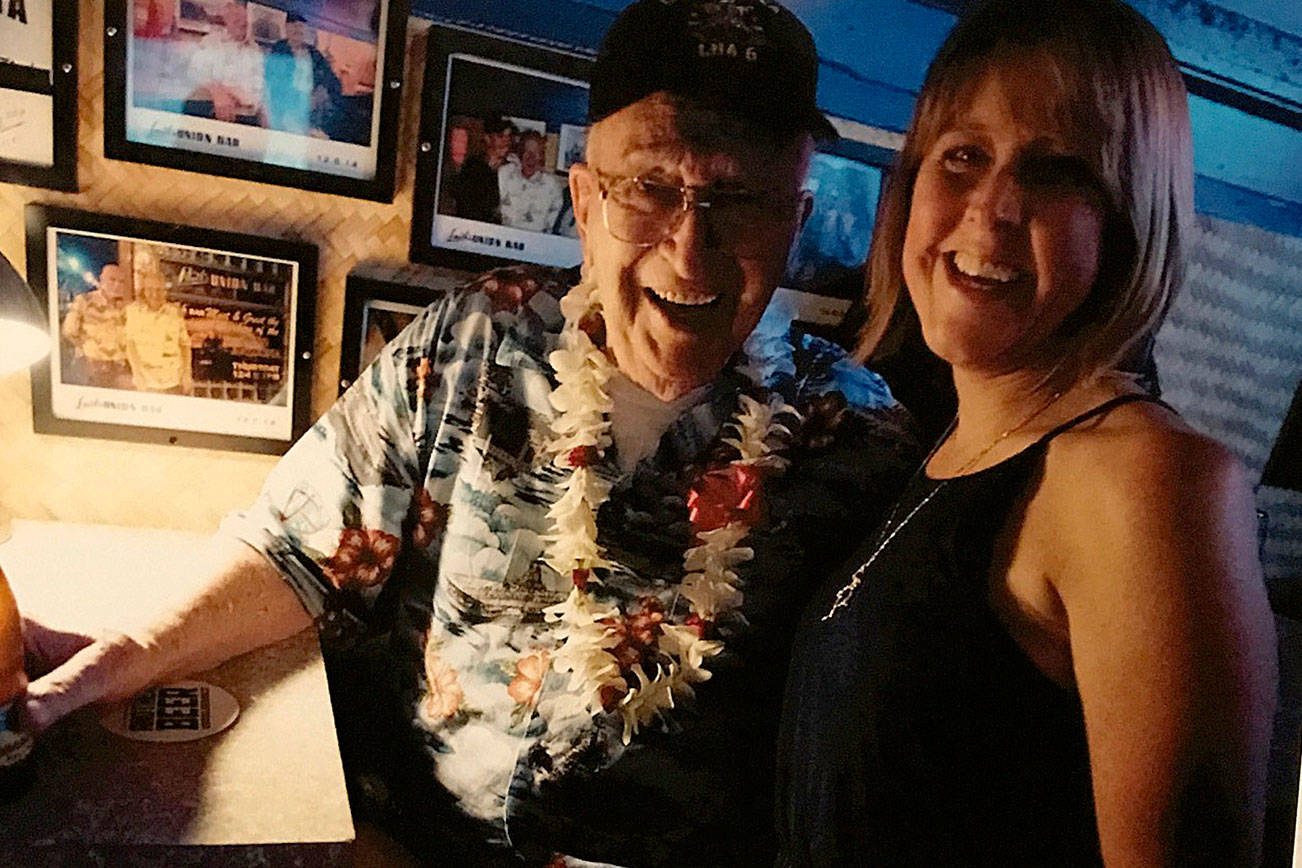 A sign at Smith’s Union Bar in Honolulu includes a picture of Lauren Bruner and Teri Mann Whyatt when they met in 2016. (Photo courtesy Teri Mann Whyatt)