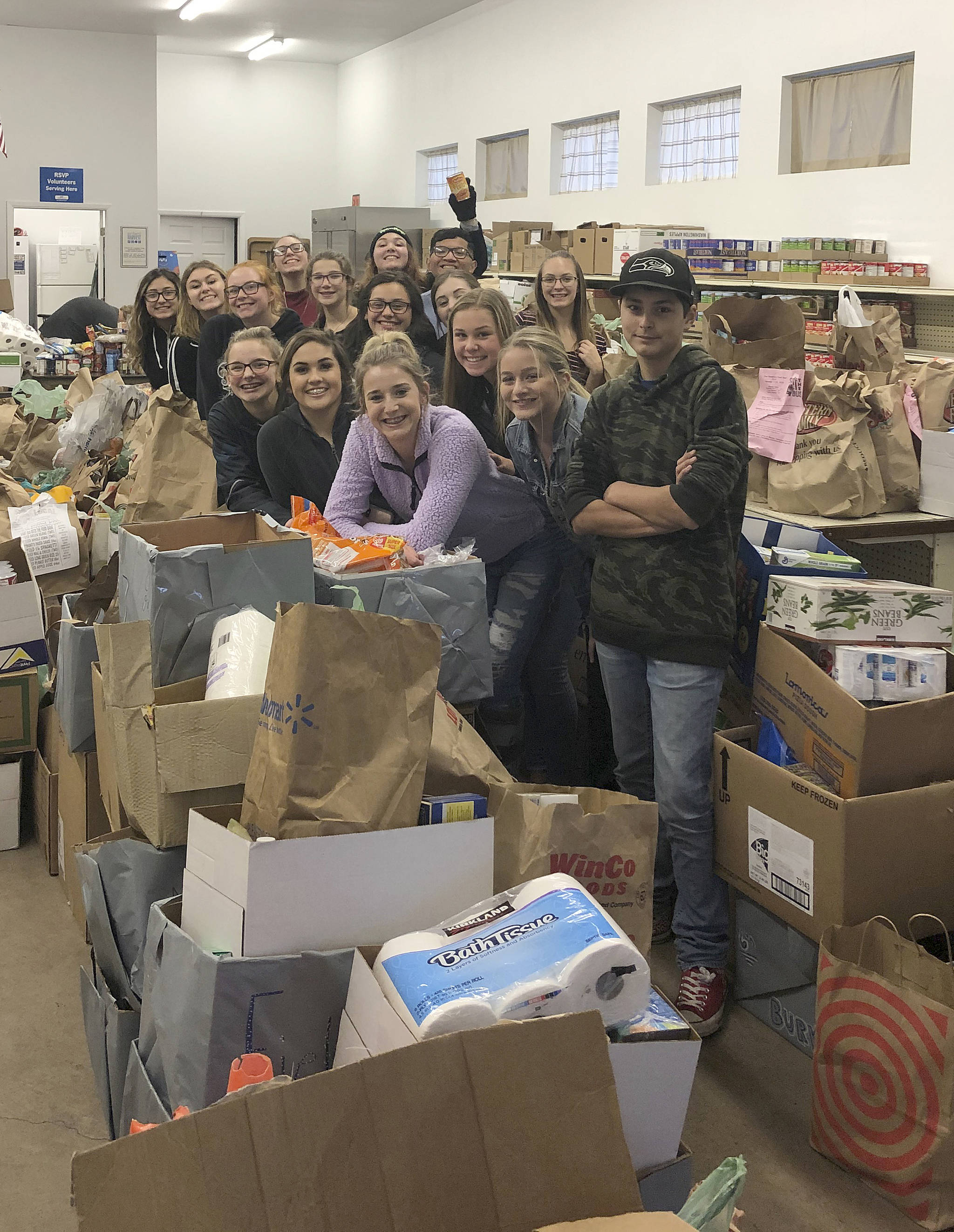 Photos courtesy Emily Wamsley                                Elma High School students pose with food they dropped off at the Elma food bank recently as part of their Food Bowl activities.