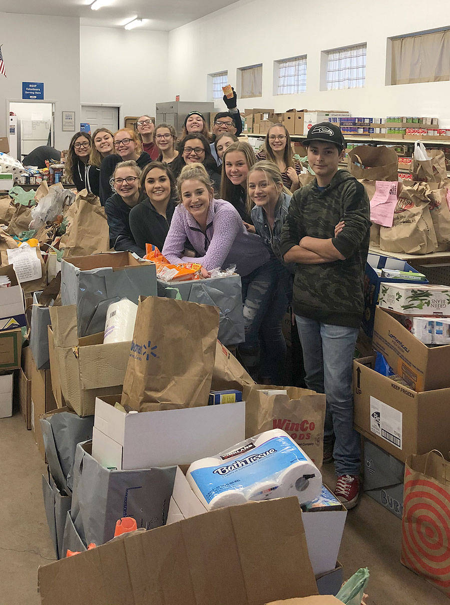 Elma High School students pose with food they dropped off at the Elma food bank recently as part of their Food Bowl activities. (Photo courtesy Emily Wamsley)