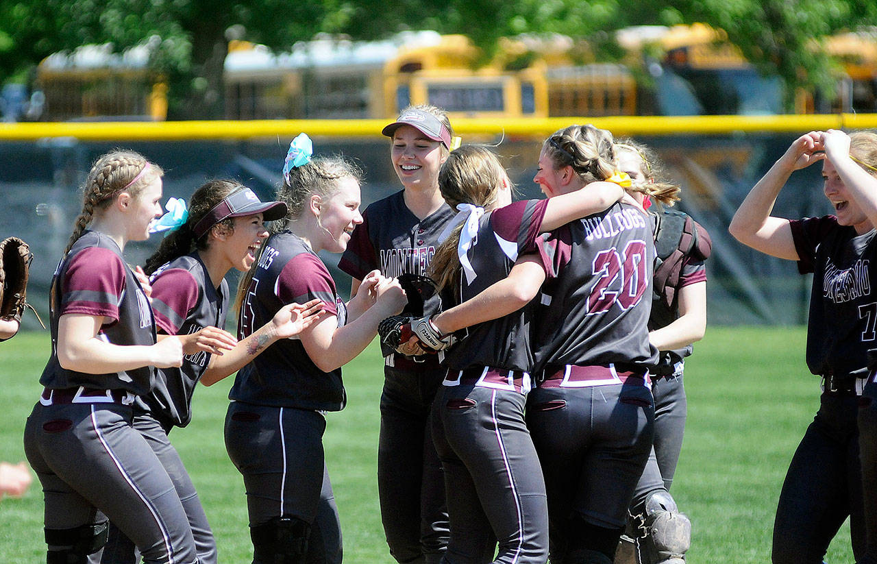 Montesano’s girls softball team celebrates after defeating Elma in the 1A state semifinals in May. Monte would go on to win its 10th state championship in program history. (File photo)
