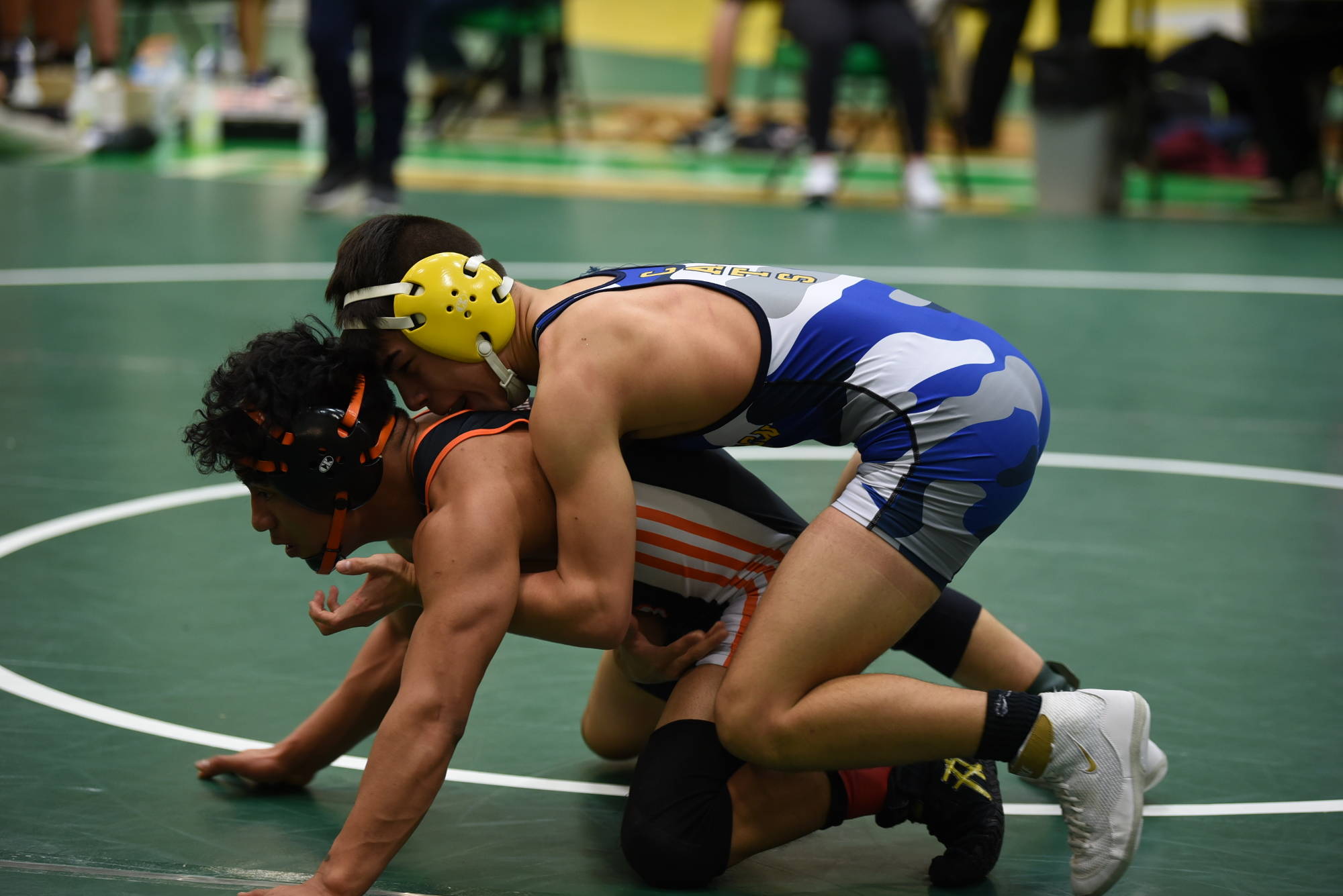 Aberdeen’s Drew Lock, top, wrestles Centralia’s Juan Gasper in the 120-pound title match of the Pat Alexander Invitational at Tumwater High School on Saturday. (Photo by Sue Michalak Budsberg)