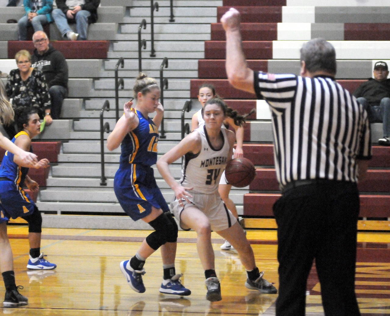 Montesano’s McKynnlie Dalan drives the baseline and is fouled by Adna’s Payton Aselton on Saturday in Montesano. (Ryan Sparks | Grays Harbor News Group)