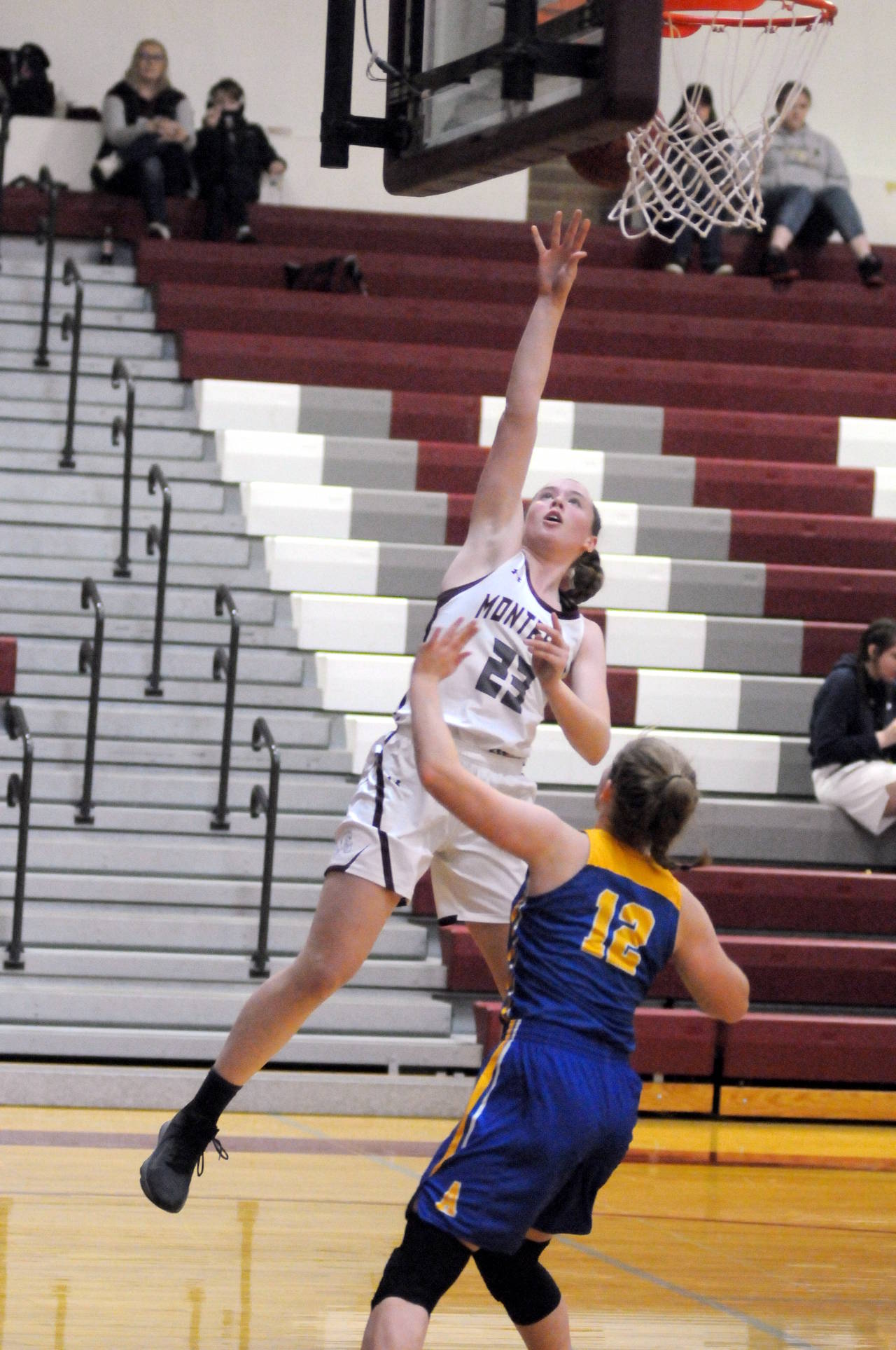Montesano sophomore Paige Lisherness (23) scores on a layup during Saturday’s 68-49 win over Adna at Montesano High School. Lisherness scored a team-high 19 points in the victory. (Ryan Sparks | Grays Harbor News Group)