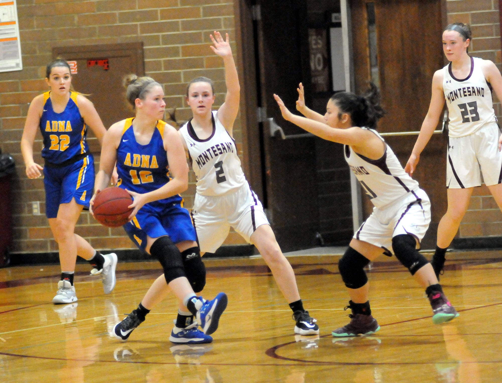 Ryan Sparks | Grays Harbor News Group                                 Montesano’s Cassadie Golding (2) and Vanna Prom defend against Adna’s Payton Aselton in the Bulldogs’ 68-49 win over the Pirates on Saturday in Montesano.