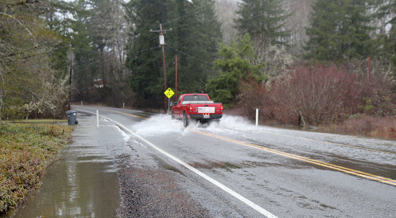 A truck drives Tuesday (Jan. 7, 2020) through water flowing over the Mox-Chehalis Road near Porter, Washington. The National Weather Service in Seattle issued a flood warning for the Chehalis River near Porter on Tuesday morning. (Michael Lang | Grays Harbor News Group)