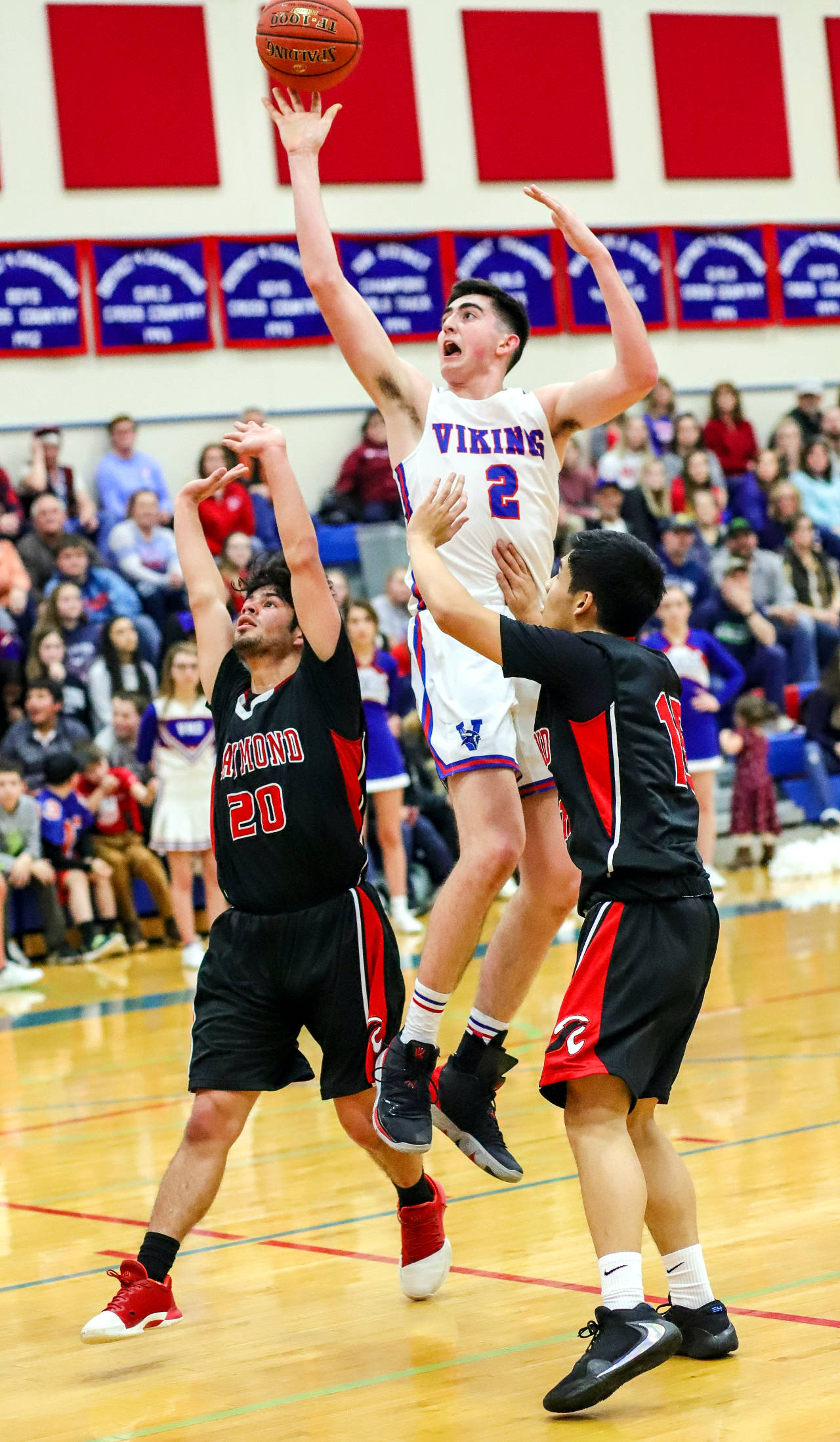 Willapa Valley’s Logan Walker (2) goes up for a shot against Raymond’s Joseph Villalpando (20) and Brian Sida (15) during Friday’s game at Willapa Valley High School. (Photo by Larry Bale)