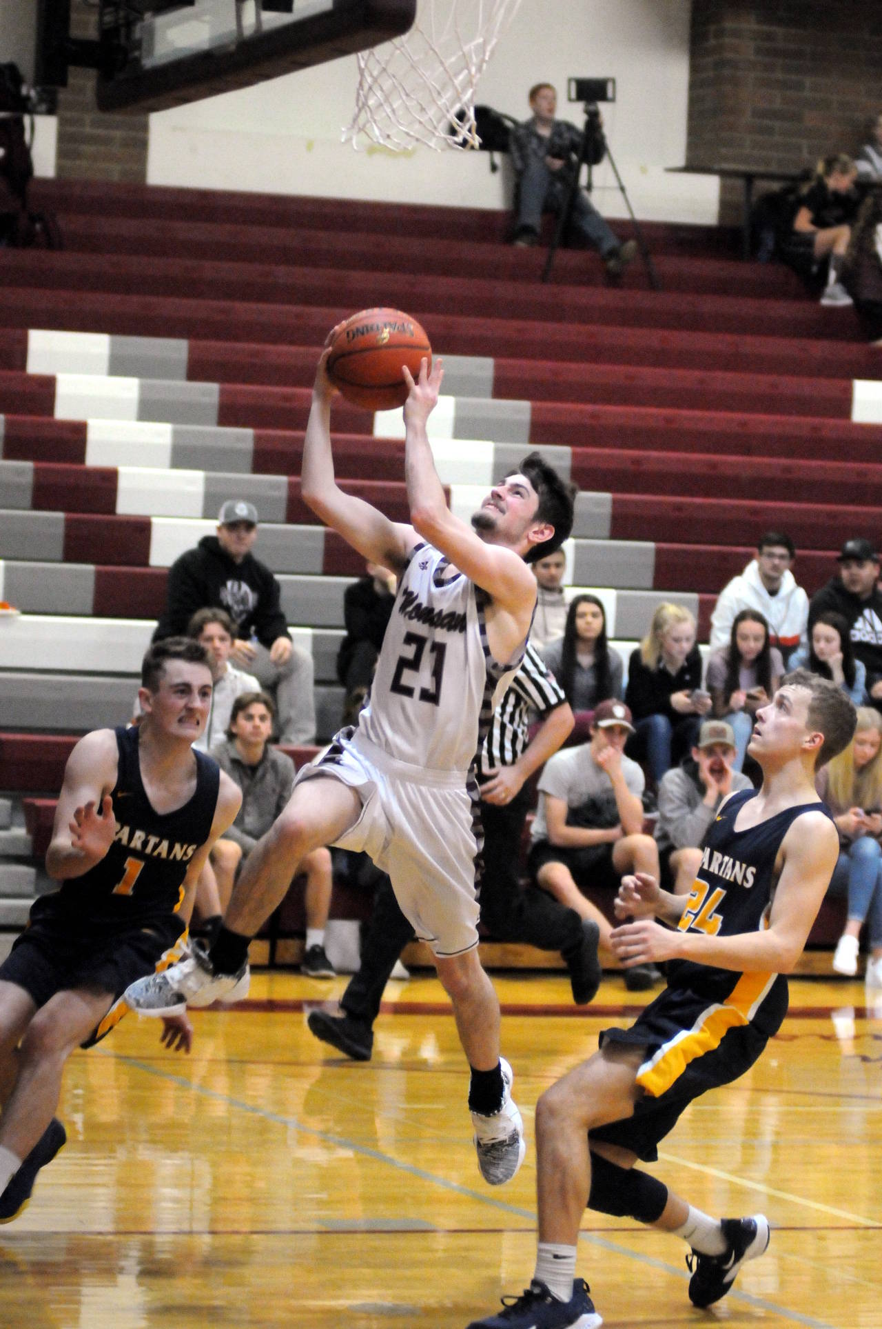 Montesano’s Colby Adams drives to the hoop during the Bulldogs’ 47-33 victory over Forks on Thursday in Montesano. (Ryan Sparks | Grays Harbor News Group)