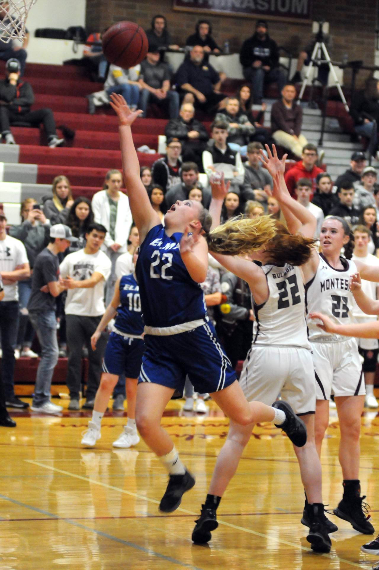 Elma’s Quin Mikel slices through the Montesano defense to score two of her nine points during a 12-2 run to end the first half in the Eagles’ 60-52 league-clinching victory on Friday in Montesano. (Ryan Sparks | Grays Harbor News Group)