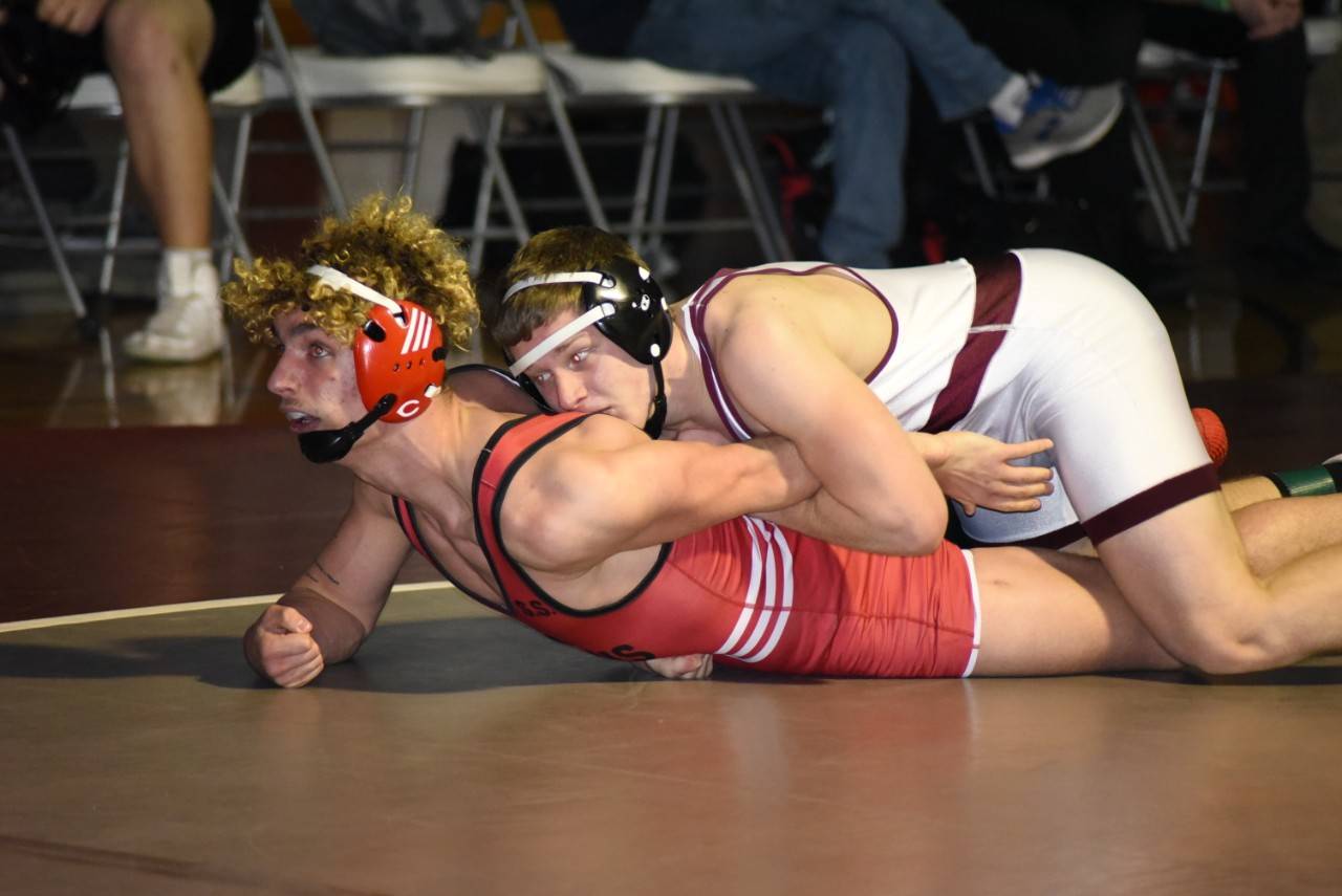 Montesano’s Brent Hollatz gains control of Castle Rock’s Bowen Durkee during the 1A Region 2 Meet on Saturday at Hoquiam High School. Hollatz won the 182-pound weight class, one of five Bulldogs to win an individual championship. (Photo by Sue Michalak Budsberg)