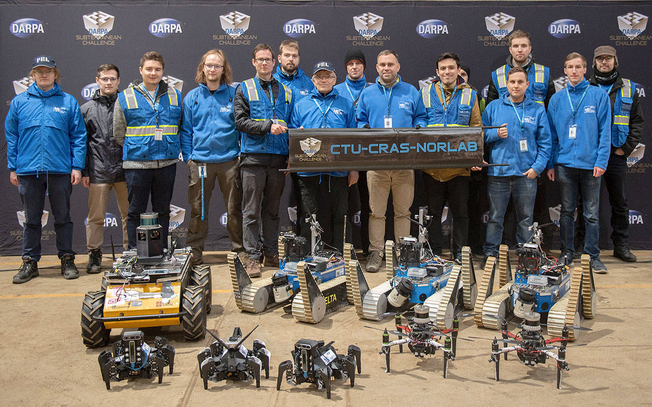 The team from the Czech Technical University - Center for Robotics and Autonomous Systems - Northern Robotics Laboratory, which is a partnership between the Czech university and the Universite Laval in Canada, poses for a photo in advance of the DARPA Subterranean Challenge Urban Circuit competition at the Satsop Business Park in Grays Harbor County. (Photo courtesy Defense Advanced Research Projects Agency)