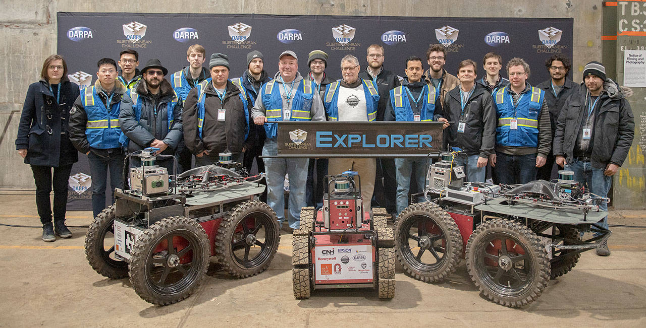 Team Explorer — a partnership with people from Carnegie Mellon University and Oregon State University — pose for a photo recently at the DARPA Subterranean Challenge Urban Circuit competition at the Satsop Business Park in Grays Harbor County. (Photo courtesy Defense Advanced Research Projects Agency)