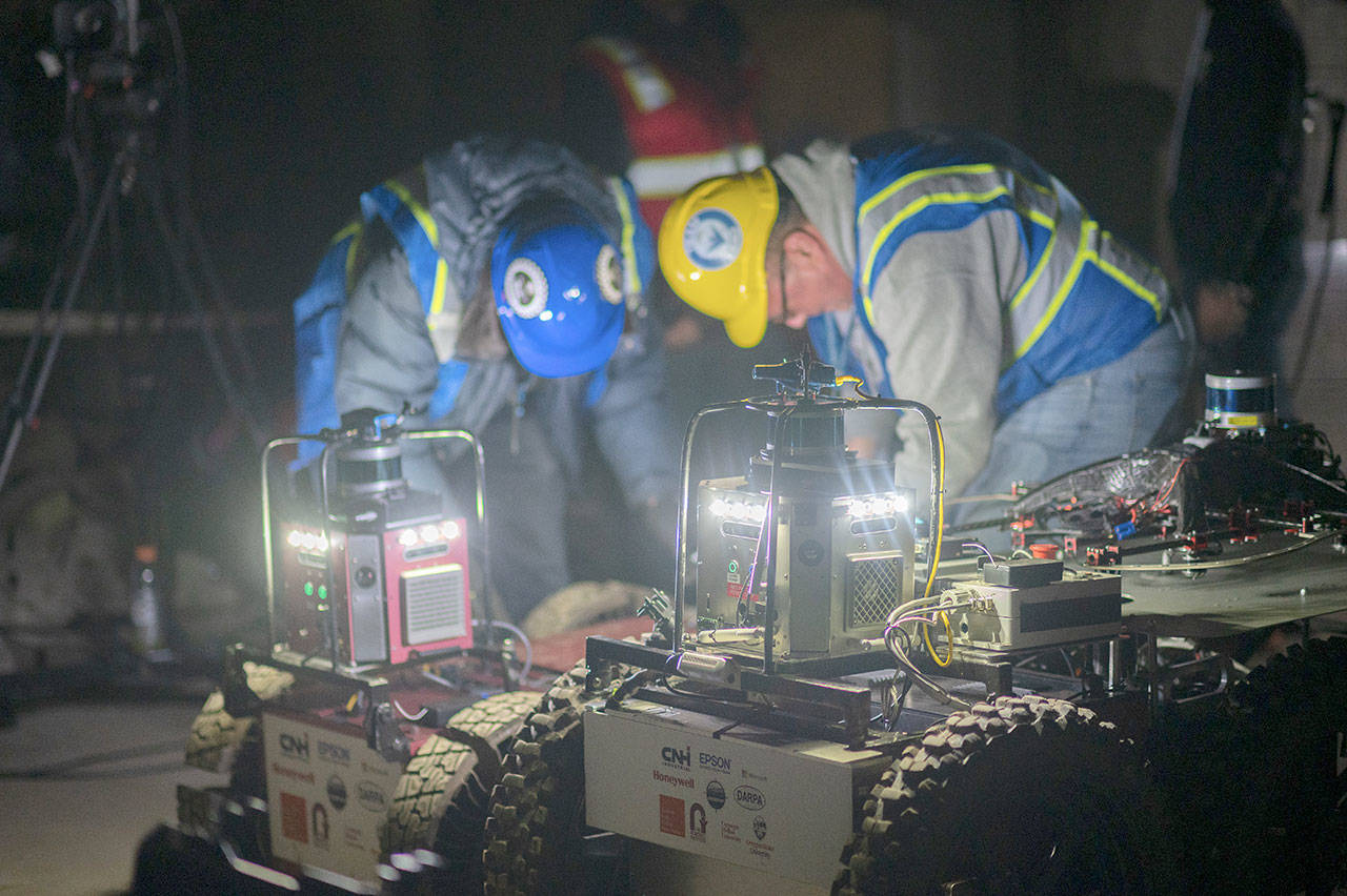 Team Explorer robots light up teammembers at the DARPA Subterranean Challenge Urban Circuit competition at the Satsop Business Park in Grays Harbor County. (Photo courtesy Defense Advanced Research Projects Agency)