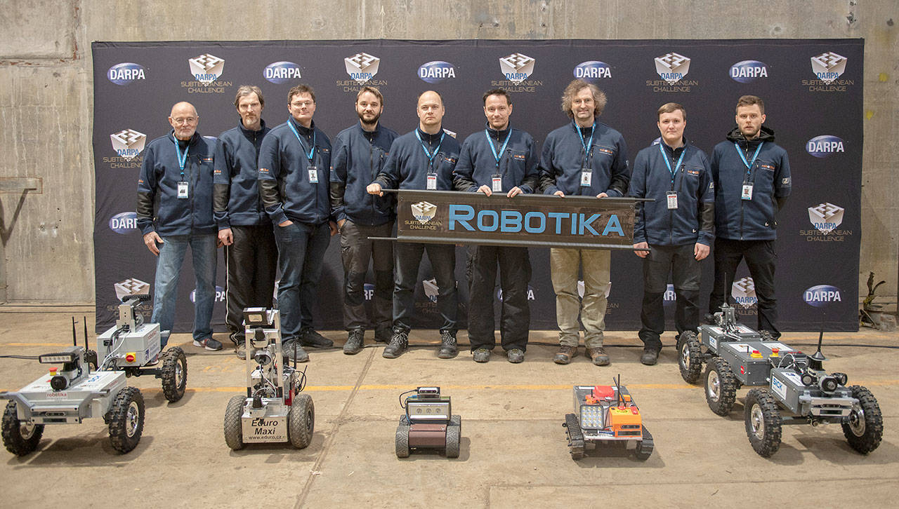 Team Robotika — from universities and businesses in the Czech Republic, Switzerland and the United States — poses for a photo recently at the DARPA Subterranean Challenge Urban Circuit competition at the Satsop Business Park in Grays Harbor County. (Photo courtesy Defense Advanced Research Projects Agency)