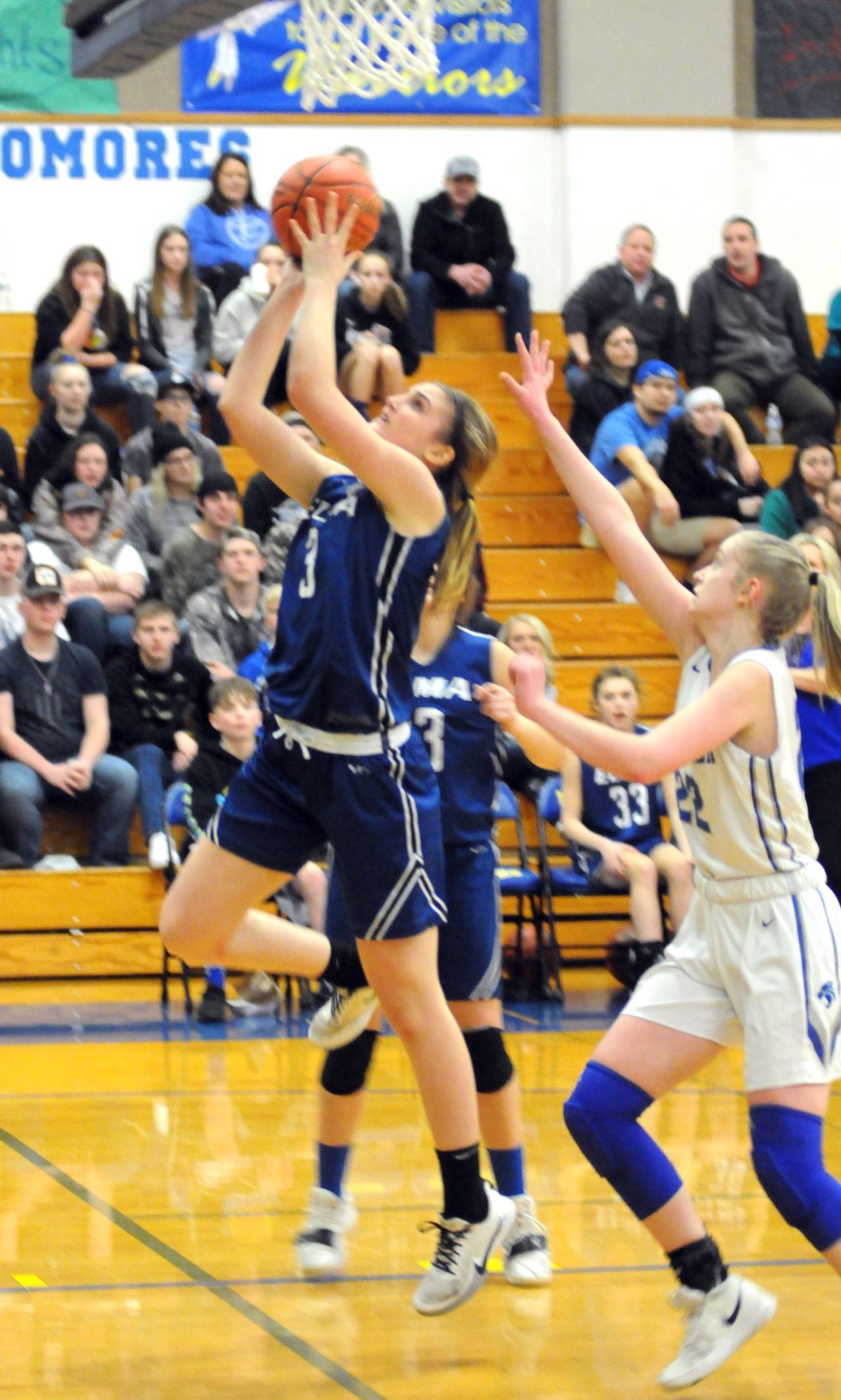 Elma’s Jalyn Sackrider, left, scores two of her game-high 31 points to lead the Eagles to their second straight 1A District 4 championship after defeating La Center 66-40 on Wednesday at Rochester High School. (Ryan Sparks | Grays Harbor News Group)