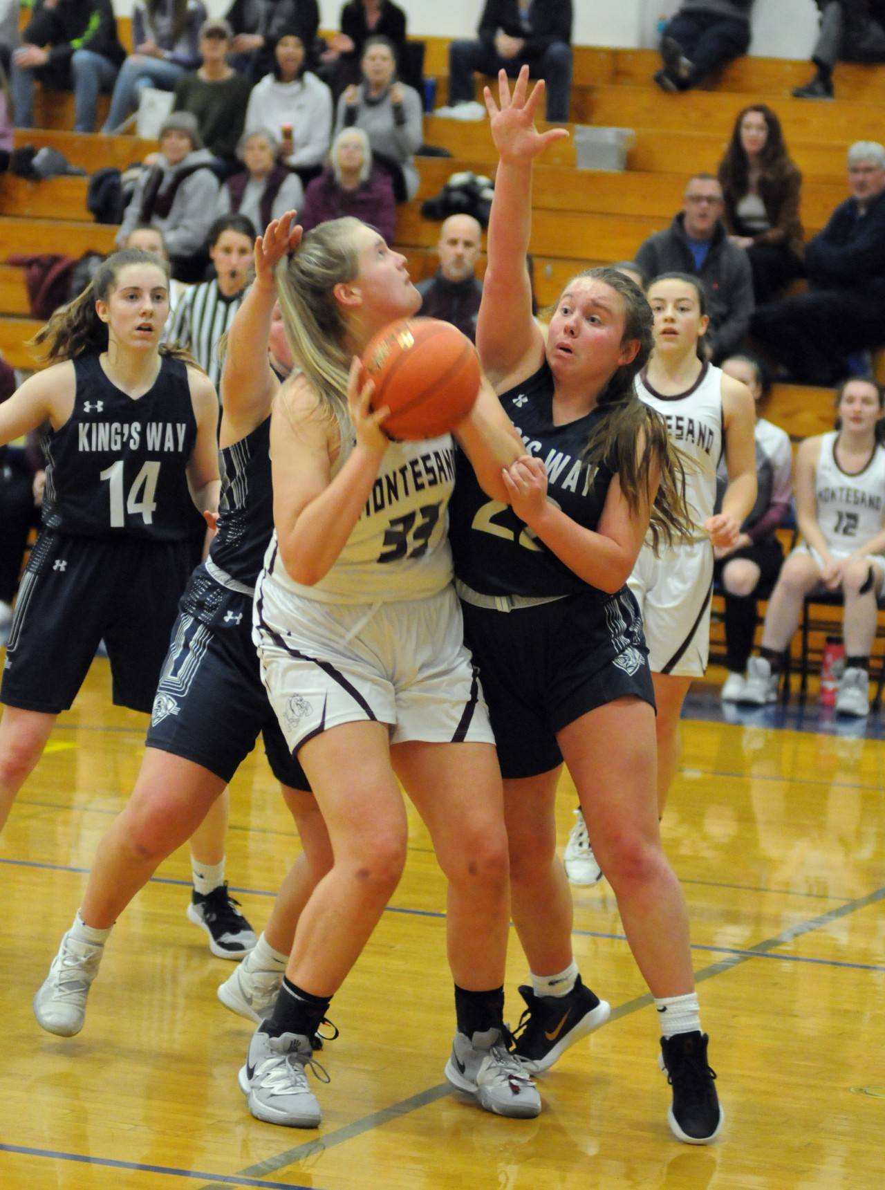 Montesano’s Zoe Hutchings (33) looks for a shot while being defended by King’s Way Christian’s Sara Thuduim during Wednesday’s 1A District 4 Girls Basketball Tournament consolation game at Rochester High School. Montesano won 43-29. (Ryan Sparks | Grays Harbor News Group)