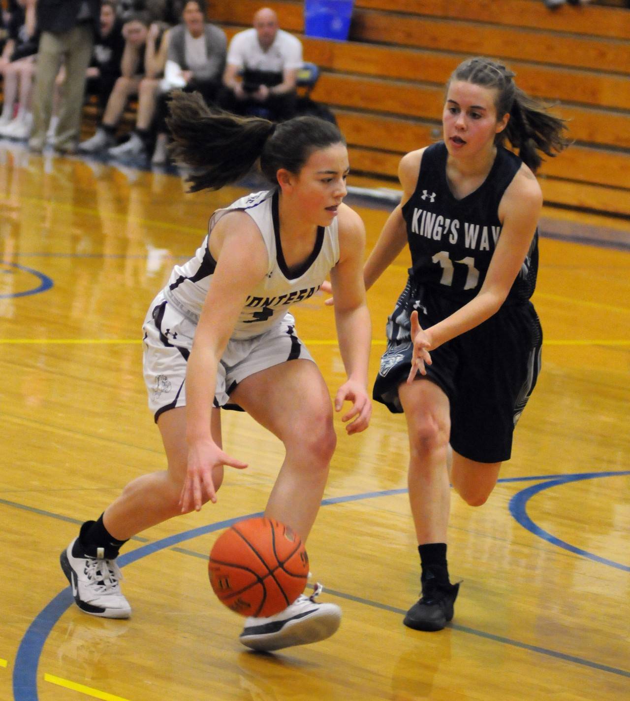 Montesno’s Jaiden King, left, dribbles while being defended by King’s Way Christian’s Annabelle Atwood during Montesano’s 43-29 elimination-game victory on Wednesday at Rochester High School. (Ryan Sparks | Grays Harbor News Group)