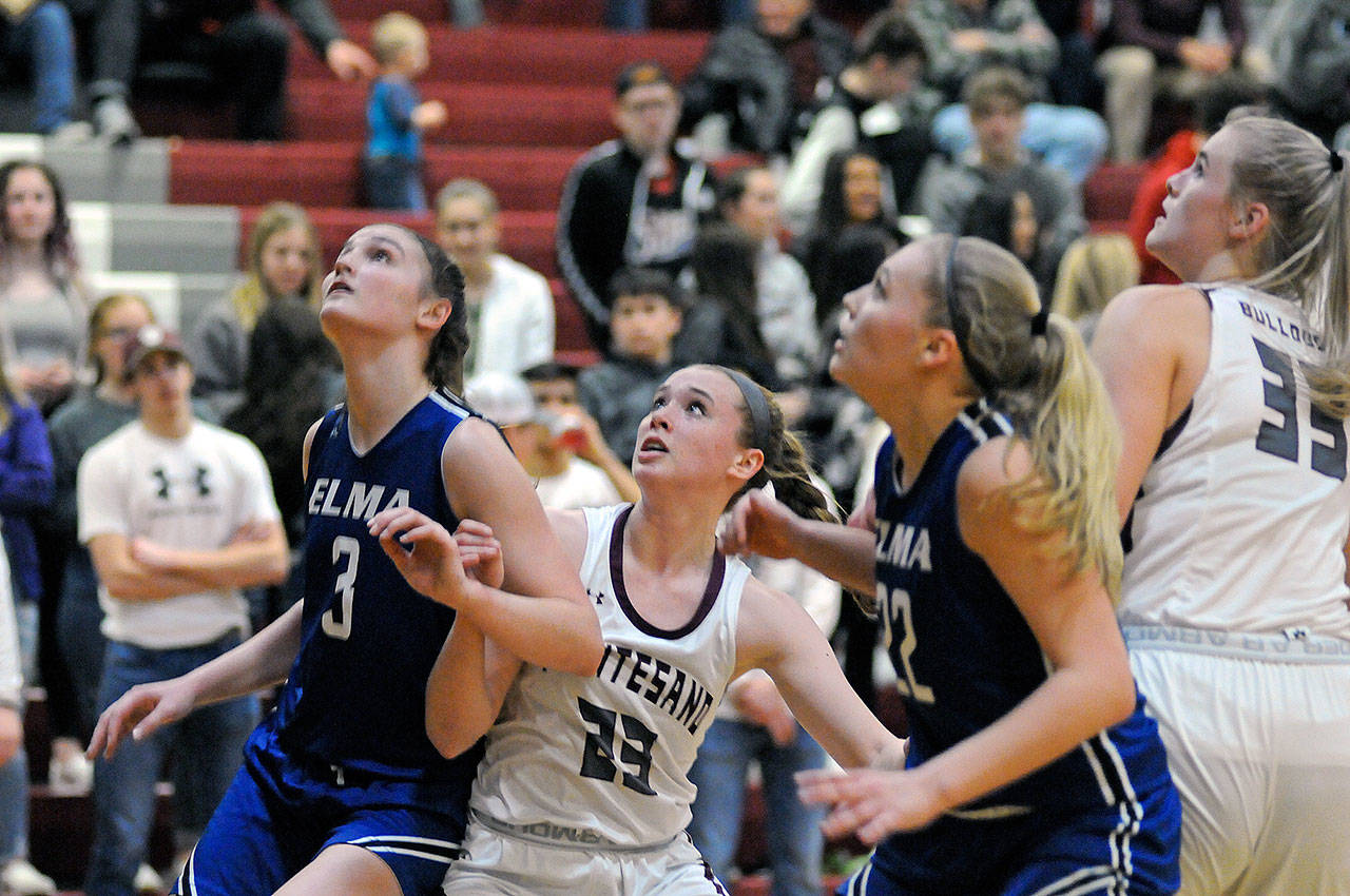 Elma’s Jalyn Sackrider (3) and Quin Mikel jostle with Montesano’s Paige Lisherness (23) and Zoe Hutchings (33) during a game on Feb. 7 in Montesano. The Eagles and Bulldogs tip-off state regional round action at noon Saturday. (Ryan Sparks | Grays Harbor News Group)