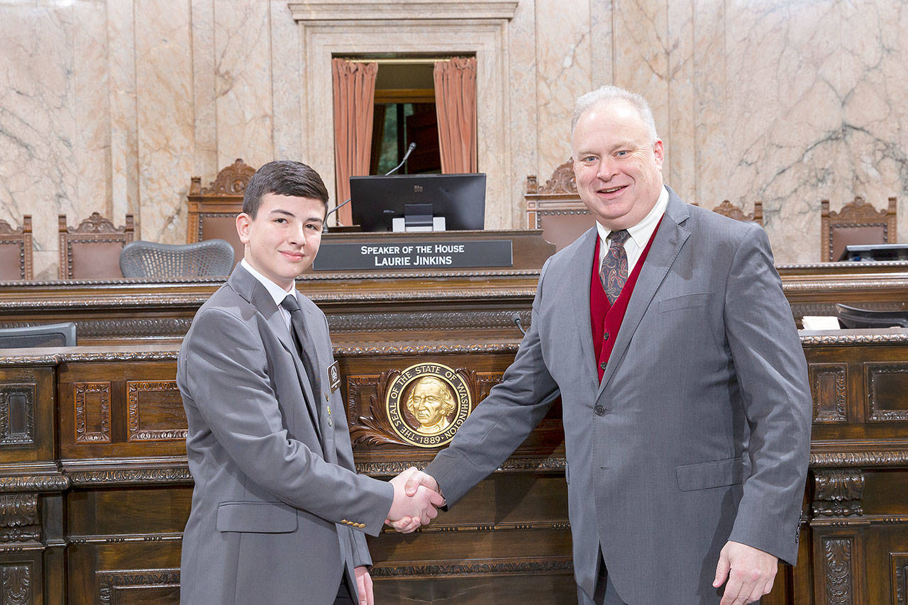 Photo courtesy Jim Walsh                                Alexander Snow, of Montesano, shakes hands with Rep. Jim Walsh on Feb. 13, while Alexander worked as a page at the Legislature in Olympia.