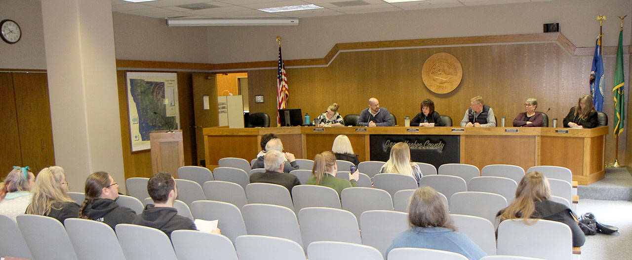 Michael Lang | Grays Harbor News Group                                 A crowd of about 12 people gathers to witness the Grays Harbor Board of County Commissioners’ workshop Feb. 25 in Montesano. Seated at the dais from left are Jenna Amsbury, clerk of the court; Commissioner Wes Cormier; Commission President Vickie Raines; Commissioner Randy Ross; Norma Tillotson, deputy prosecuting attorney; and Tracey Munger, civil deputy prosecuting attorney.