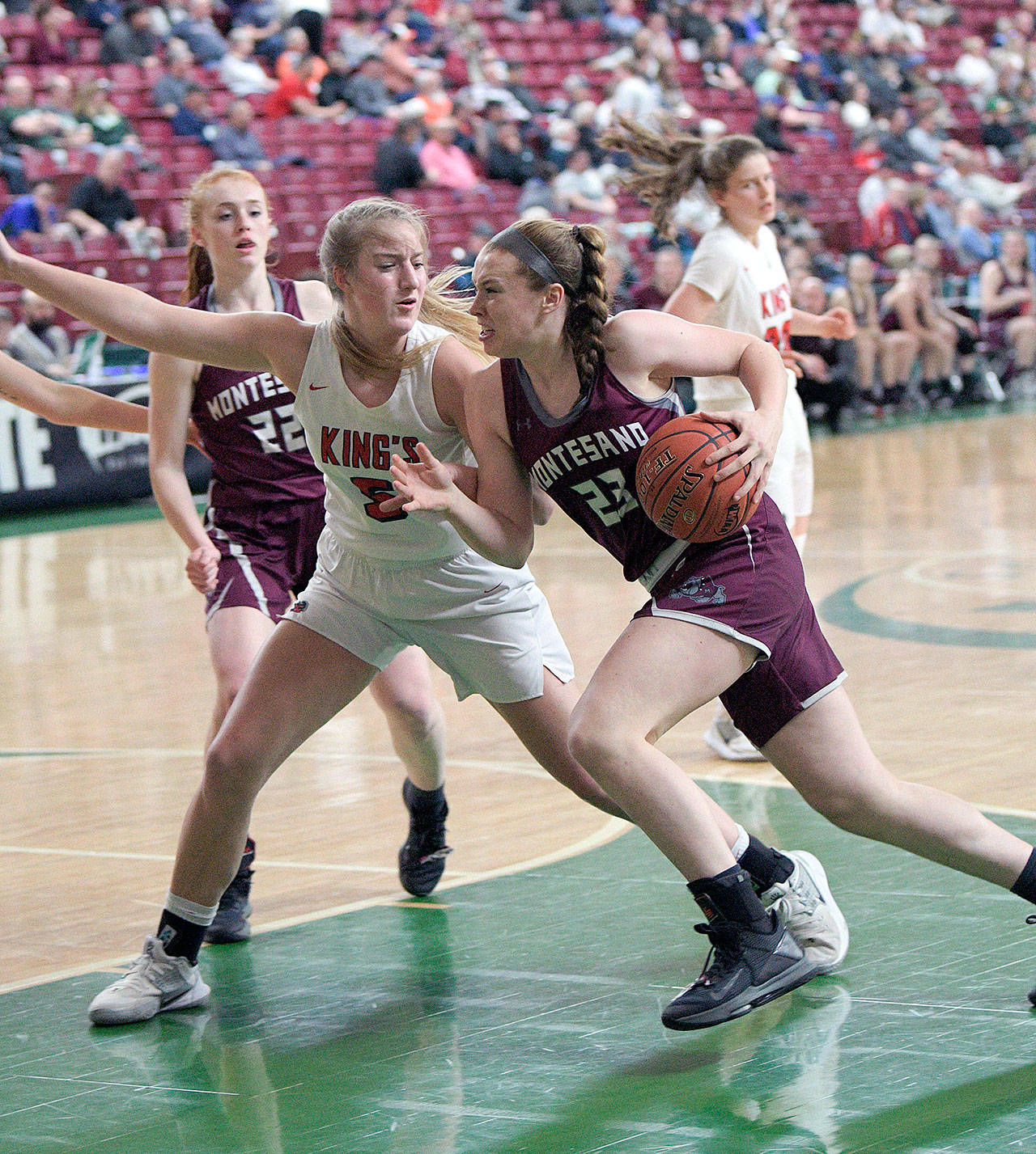 Montesano’s Paige Lisherness (23) drives the lane against Kings’ Mia Flor during the Bulldogs’ 65-43 first-round loss on Wednesday in the 1A State Tournament at the SunDome in Yakima. (Photo by Robert Beldin)