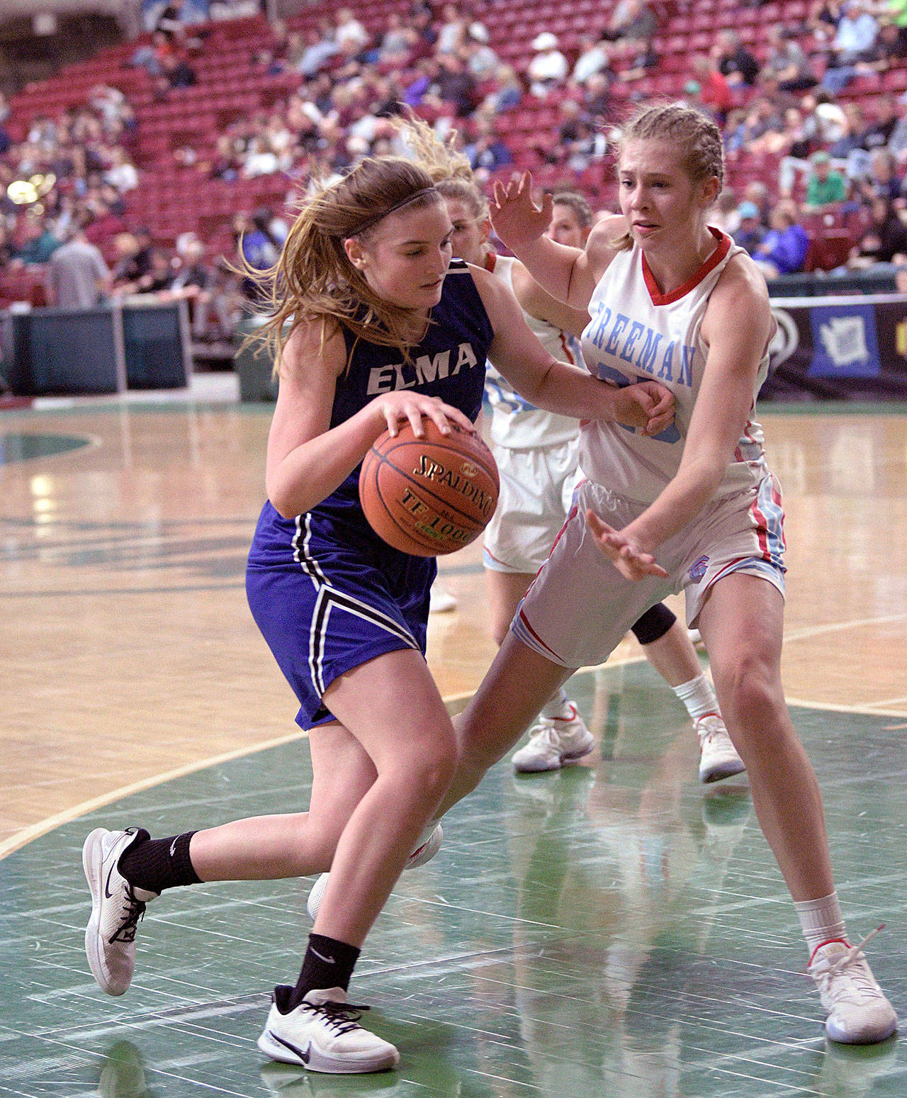 Elma’s Jalyn Sackrider, left, dribbles against Freeman’s Jaycee Goldsmith during the Eagles 49-25 loss in the 1A State Tournament on Wednesday at the SunDome in Yakima. (Photo by CJ Mudgett)