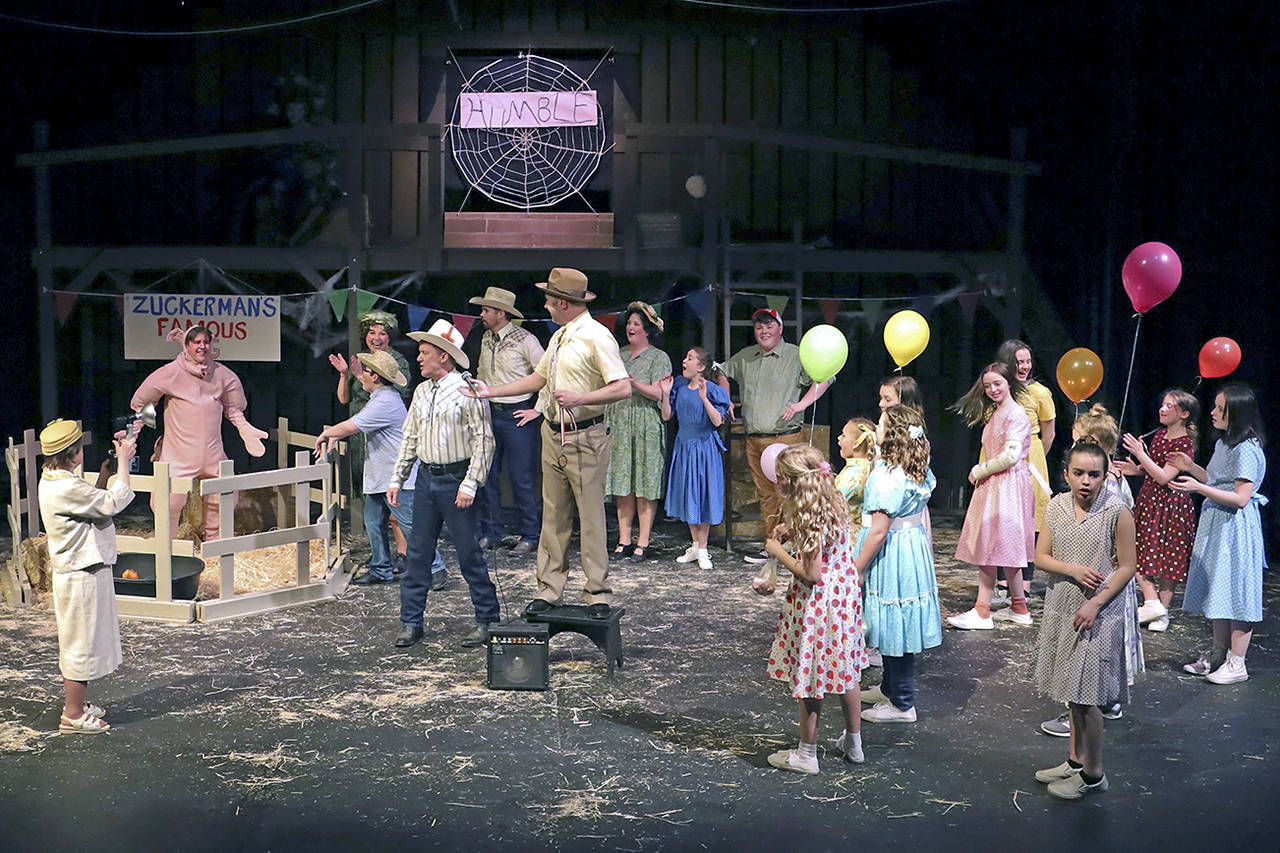 Keith J. Krueger photos                                Left, A crowd gathers to see Zuckerman’s “humble” pig in the Driftwood Children’s production of “Charlotte’s Web.”                                Above, Charlotte the barn spider (played by Mikaela Murphy) speaks from the rafters.