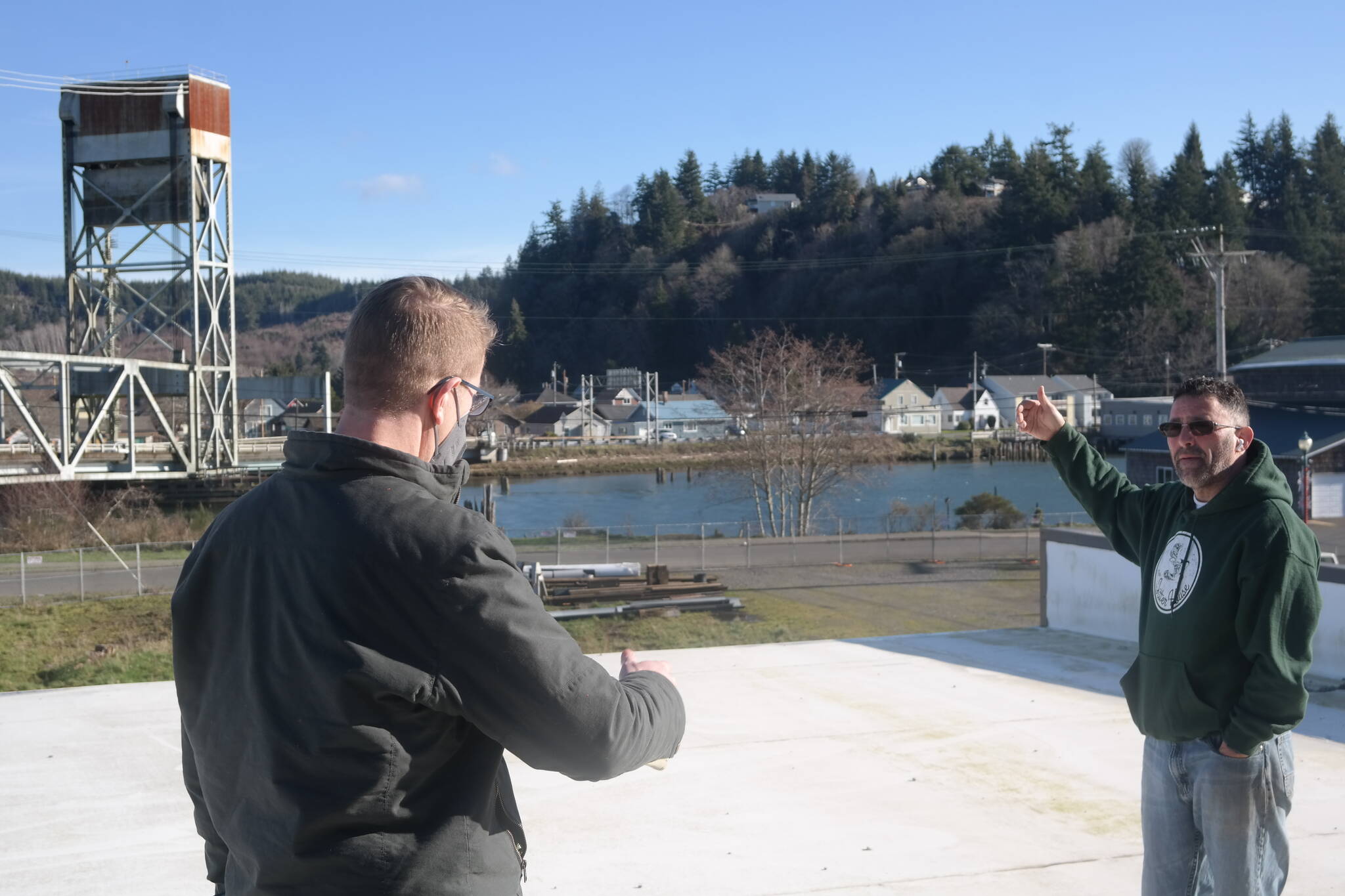 Congressmen Derek Kilmer, left, and Jitter House owner Sam Nazario chat about the future of downtown businesses along the Hoquiam River. Erika Gebhardt | The Daily World