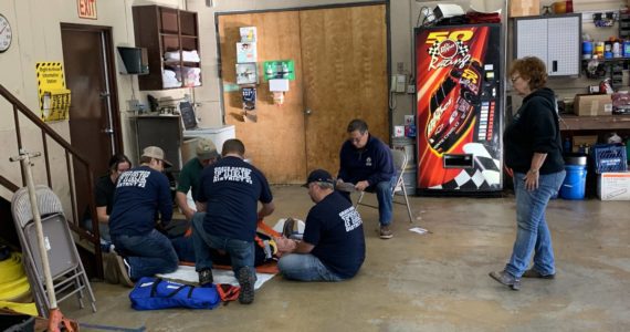 Certified GHEMS instructors teach a spinal immobilization class at Grays Harbor Fire District #2. Embedded instructors do not receive financial compensation through the department for their instruction, and must also maintain their own up-to-date certifications to teach. Photo courtesy of Louisa Schreier