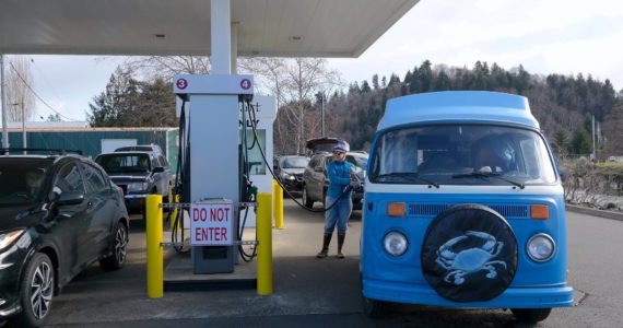 Grays Harbor County resident Willow Jorgenson fills up at the Q-Mart in Aberdeen. Rising gas prices are likely to alter her plans for excursions along the coast. Erika Gebhardt I The Daily World