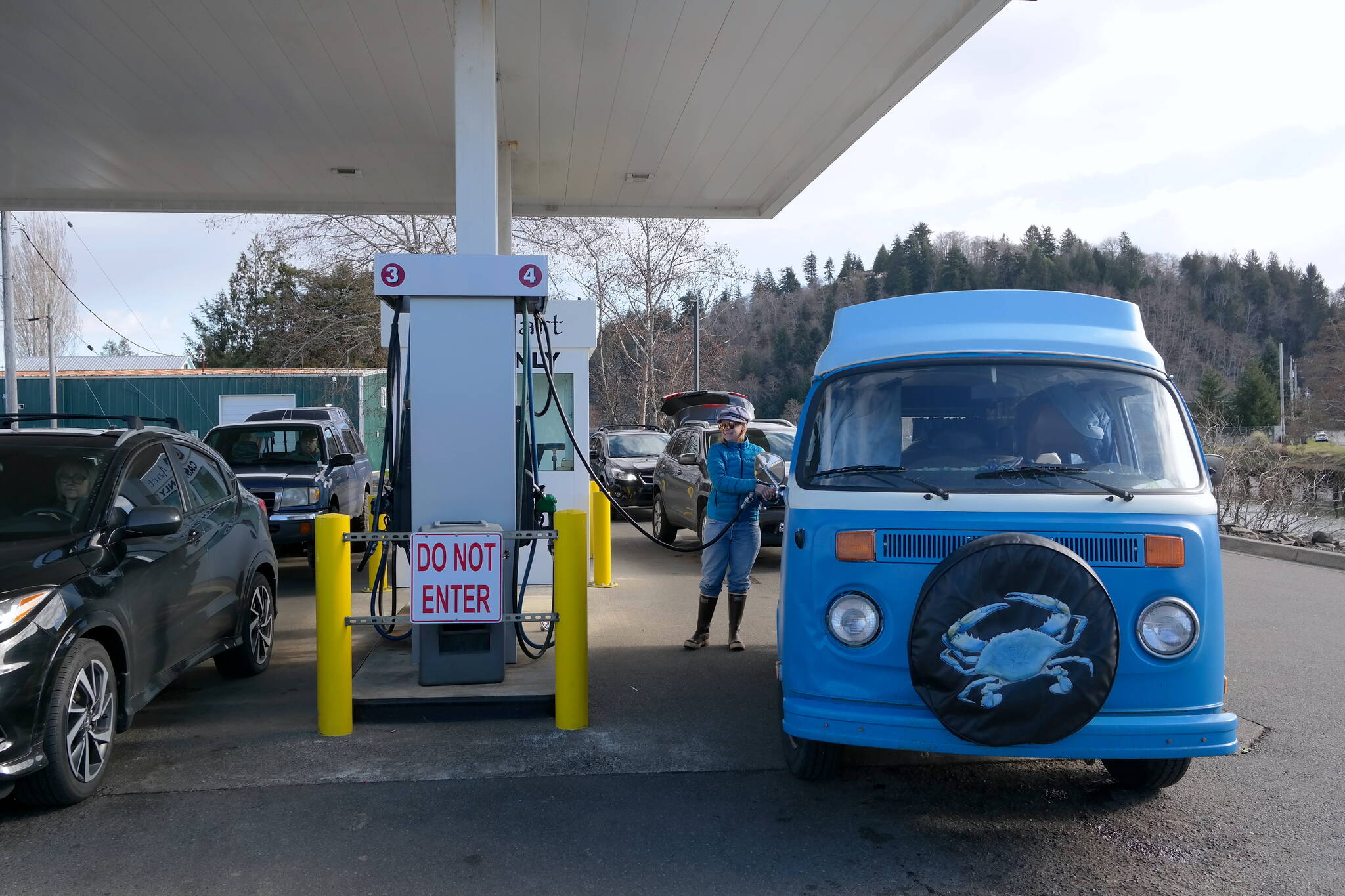 Grays Harbor County resident Willow Jorgenson fills up at the Q-Mart in Aberdeen. Rising gas prices are likely to alter her plans for excursions along the coast. Erika Gebhardt I The Daily World