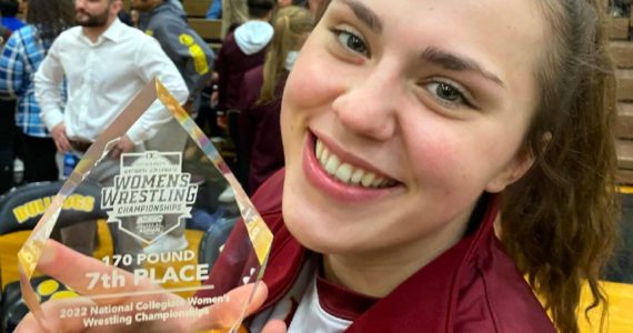 SUBMITTED PHOTO Former Aberdeen Bobcats and current Colorado Mesa University wrestler Tatum Heikkila poses with her seventh-place trophy at the NCWA Championships on Saturday in Adrian, Michigan. With her performance, Heikkila became the first Twin Harbors female wrestler to earn NCAA All-American status.