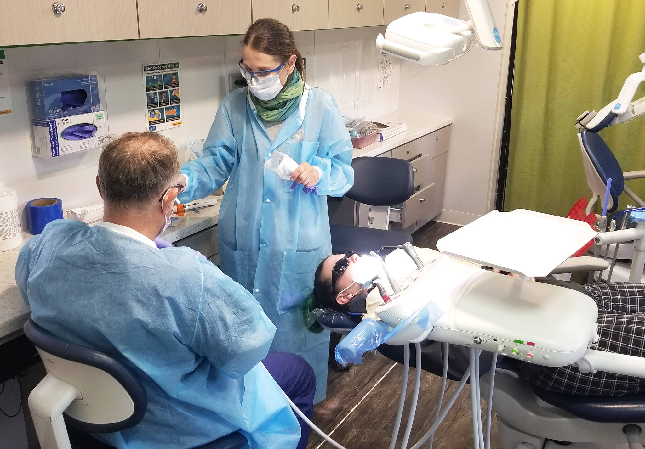 A patient is getting a chipped tooth repaired by the dentists inside the SmileMobile on April 26, 2022, in Elma. Allen Leister l The Daily World
