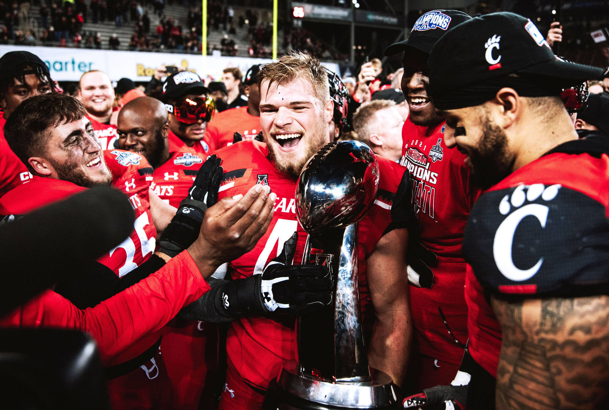 Joel Dublanko (center) celebrates with teammates following the Bearcats AAC Championship game victory over the Houston Cougars at Nippert Stadium in Cincinnati, Ohio on Dec. 4, 2021. (Photo courtesy of Joel Dublanko)