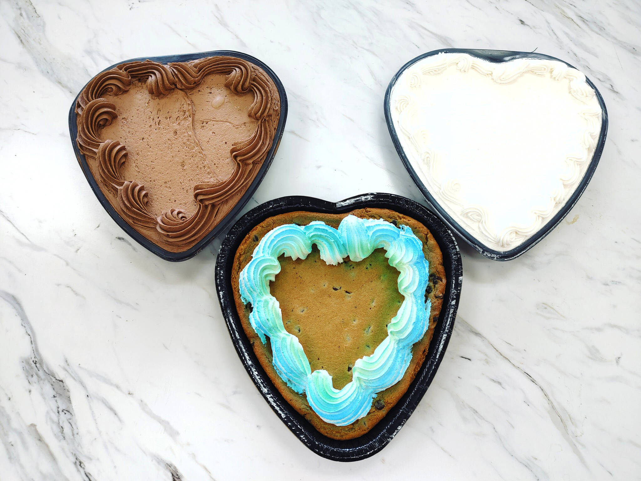 (Photo Courtesy of Pick-Rite Thriftway)
                                Children decorated fresh-baked goods, such as large heart shaped chocolate chip cookies or single layer cakes any way they would like. The event was hosted at the Pick-Rite Thriftway bakery on Saturday, June 18, 2022, in Montesano.