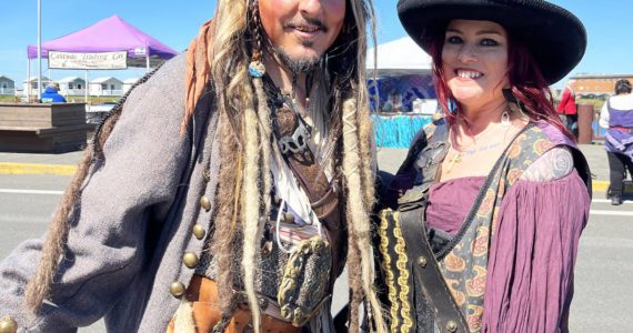 (Matthew N. Wells | The Daily World) “Capt. Jack Sparrow,” and “Angelica,” the daughter of “Blackbeard,” played by Mike and Christine Vassar, were happy to oblige tourists, and The Daily World with an explanation of their dress, act, and why they love coming to Rusty Scupper’s Pirate Daze. The duo has come for about the last decade, and doesn’t plan on ending their tradition of driving from their home in St. Helens, Ore.