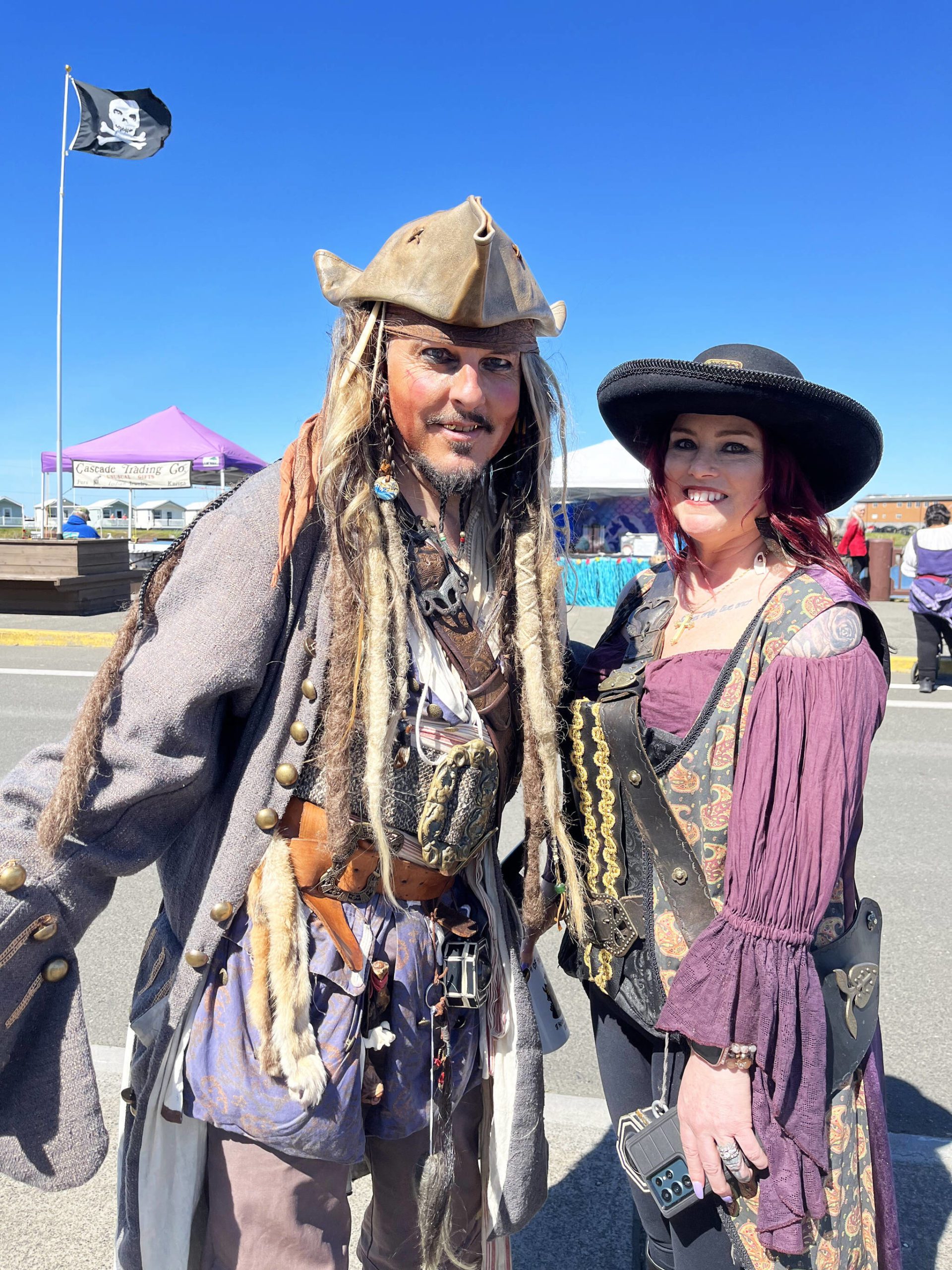 (Matthew N. Wells | The Daily World) “Capt. Jack Sparrow,” and “Angelica,” the daughter of “Blackbeard,” played by Mike and Christine Vassar, were happy to oblige tourists, and The Daily World with an explanation of their dress, act, and why they love coming to Rusty Scupper’s Pirate Daze. The duo has come for about the last decade, and doesn’t plan on ending their tradition of driving from their home in St. Helens, Ore.