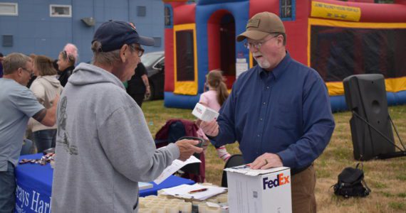 (Allen Leister | The Daily World)
                                Professional health officials such as Kenneth Bangs (Right), provided the public with education and distribution of resources like NARCAN and Fentanyl test strips that can used to help overdosed individuals on Aug. 31, at the Overdose Awareness Day event, in Aberdeen.