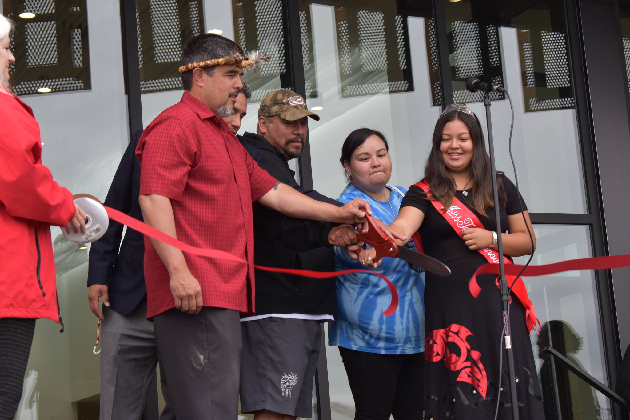 (Matthew N. Wells | The Daily World)
                                Quinault Indian Nation President Guy Capoeman (left) cuts the Quinault Wellness Center ceremonial ribbon with other members of the Quinault tribe on Aug. 31, in Aberdeen. The treatment center is excepted to have its grand opening on Oct. 3.