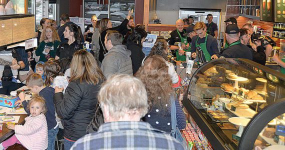 (Dan Hammock / The Daily World file)
                                Police and Aberdeen residents crowd the Aberdeen Starbucks in 2022 for Badges & Brews. This year’s event brought the Aberdeen Fire Department, Grays Harbor County Sheriff’s Office and Aberdeen emergency management personnel to the event.